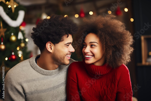 Happy Black Woman and Man Wearing Christmas Jumpers on a Holiday Background. Festive Joy