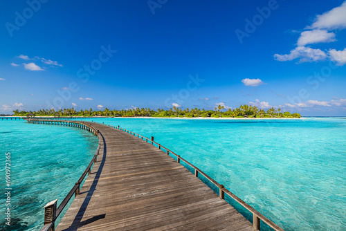 Best travel landscape. Exotic island sea bay wooden pier over pristine lagoon leads into beautiful tropical paradise, coco palm trees white sand. Calm water, sunshine. Amazing vacation, luxury resort 