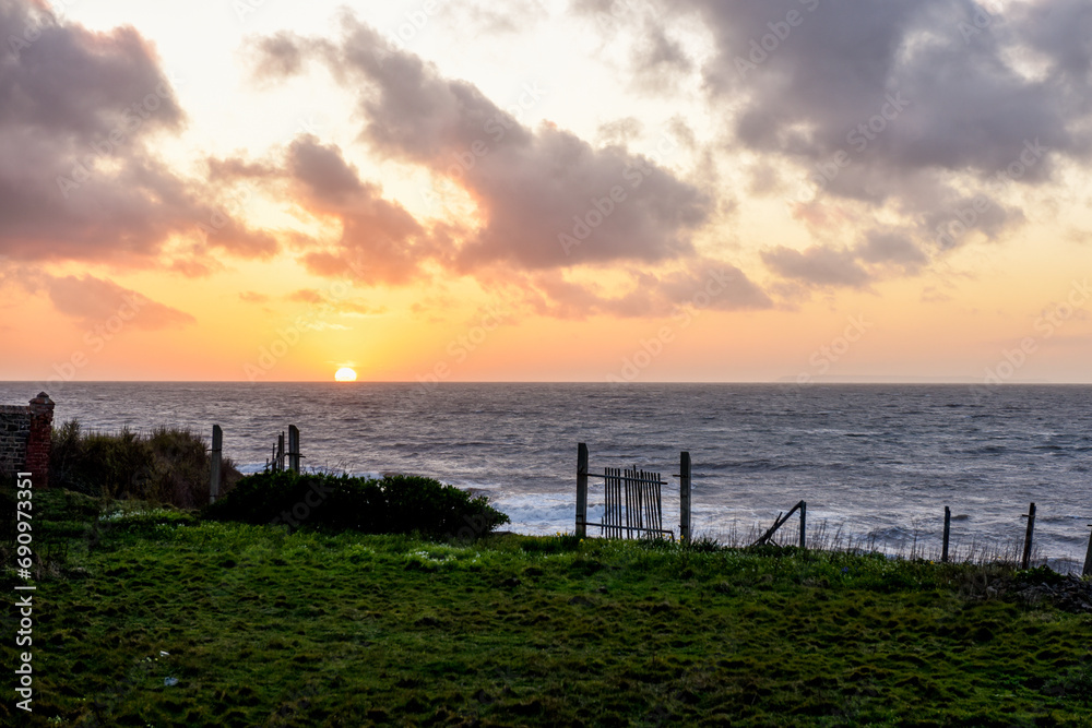 Sunset over sea from a cliff top view Sunset over sea from a cliff top view