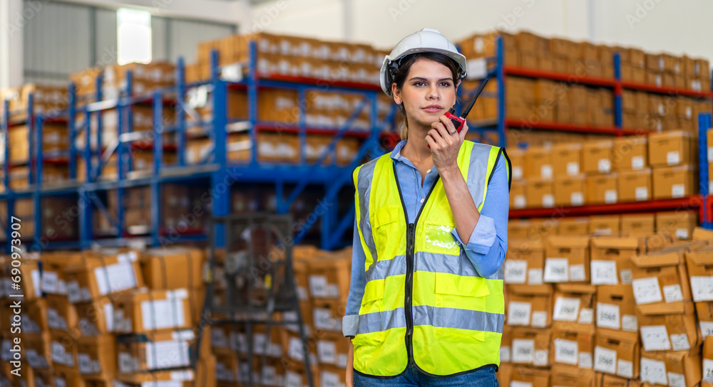 Portrait engineer woman shipping order detail check goods and supplies on shelves with goods background inventory in factory warehouse.logistic industry and business export.