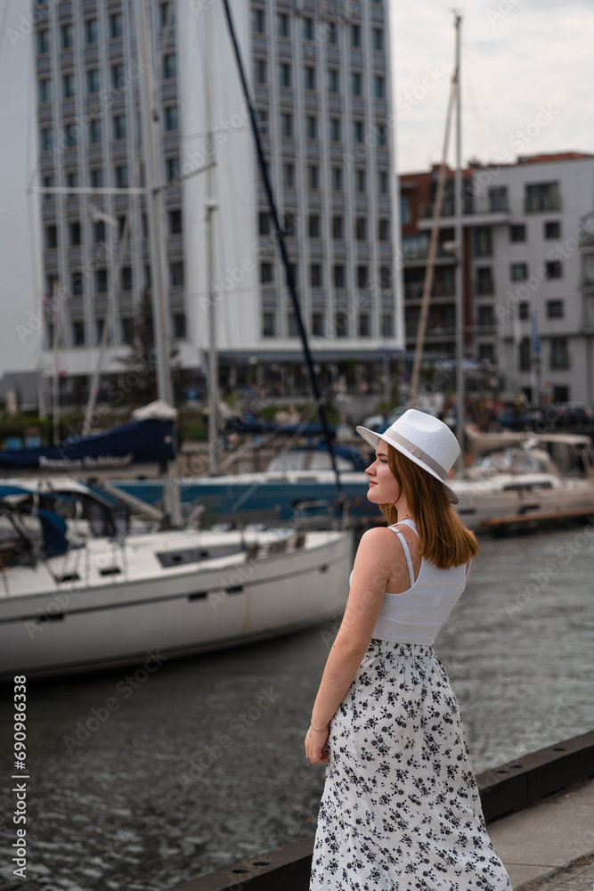 girl in a white hat on the background of the city of Gdansk Poland Europe