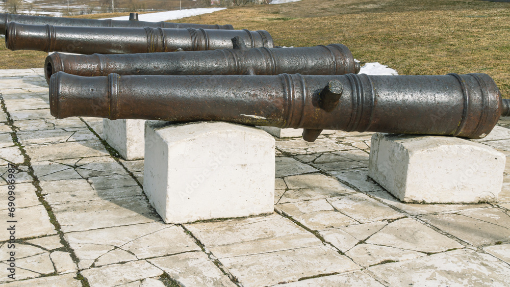 Antique cast iron cannons for firing cores. Ancient weapons for war and defense against attacks.