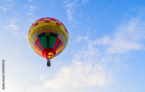 Big colorful balloon on blue sky background