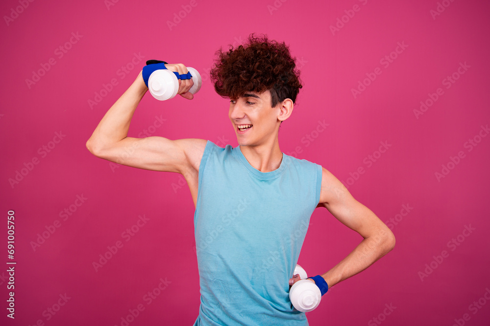 Retro style. Funny curly guy doing aerobics in the style of the 80s. Pink background.