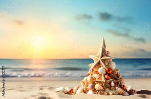 Christmas Tree Made of Ornaments, Starfish and Seashells On The Ocean Shore Beach Sand.