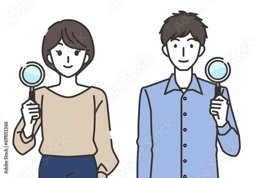 虫眼鏡を持つ男性と女性