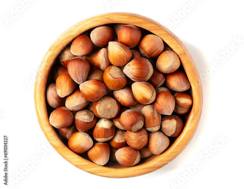 Wooden bowl with hazelnut kernels isolated on white background, cut out,top view 