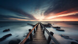 An exposure of the wooden bridge leading to the ocean with the soft water effect and cloudy sky of a sunrise or sunset. Innovative AI.
