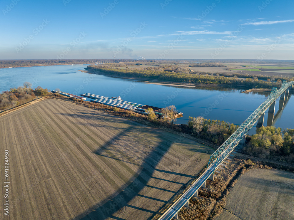 bridge and barges on the Mississippi  River at confluence with the Ohio River below Cairo, IL, November aerial view
