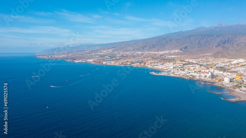 Aerial photo from drone to de Tenerife and beachs Adeje Playa de las Americas, Playa Honda,Playa de Troya, Playa de El Bobo.In the background Tenerife at sunset. Tenerife, Canary islands, Spain