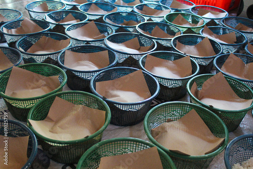 Preparation of Nasi berkat, traditional food package from Indonesia. Meal given after religious recitation on Javanese tribe.