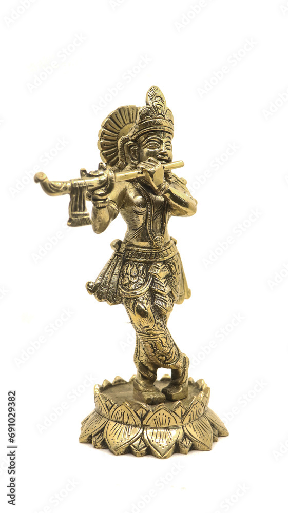 lord krishna golden idol isolated in a white background