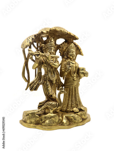 radha krishna under a tree bronze idol from an antique collection isolated in a white background 