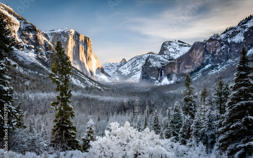 Majestic Winter Serenity, A Snowy Mountain Pass Journey Amidst Evergreen Splendor photo