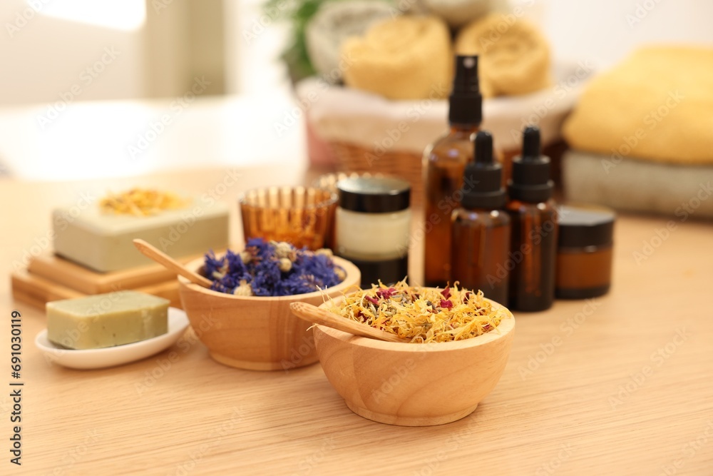 Dry flowers and soap bar on wooden table indoors. Spa time Dry flowers and soap bar on wooden table indoors. Spa time