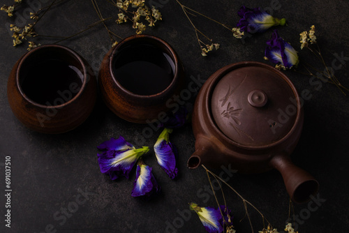 Antique brown chinese tea set on black background