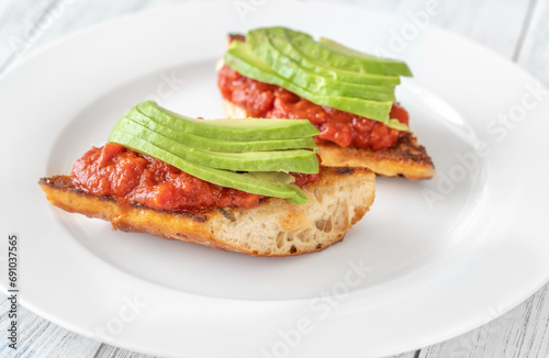 Bruschettas with tomato spread and avocado