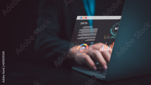 Business people use computers to analyze business and manage corporate data, business analytics with charts, metrics and KPIs to improve organizational performance, marketing
