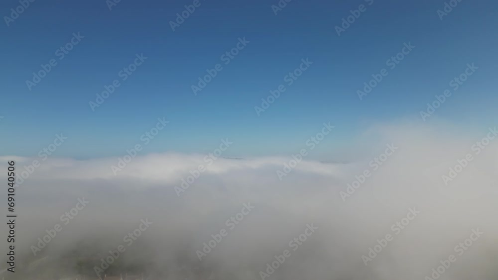 Drone Falling Through Low Clouds to an Urban Area Drone Falling Through Low Clouds to an Urban Area