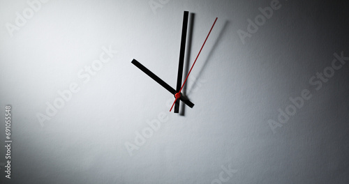 Abstract clock - modern clock hands showing time under dramatic light photo