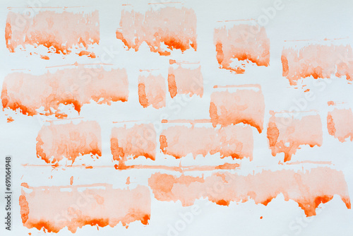 collection of gradient orange stains on blank paper
