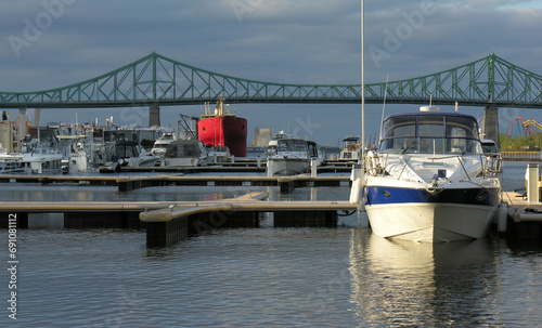 Panoramic view of a marina with the Jacques-Cartier Bridge in the background in Montreal.