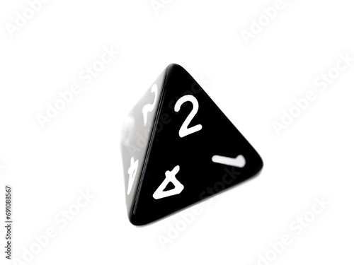 A black D4 four sided dice isolated on white. RPG dice. tetrahedron DND dice