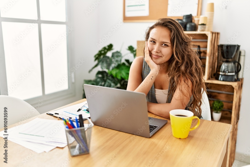 Young beautiful hispanic woman business worker using laptop working at office Young beautiful hispanic woman business worker using laptop working at office