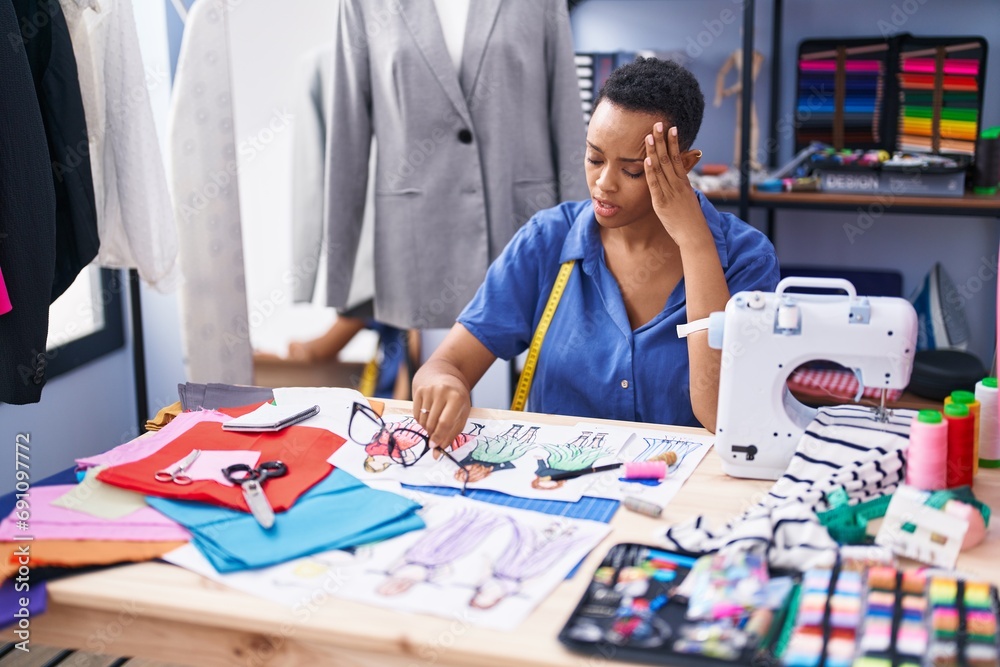 Fototapeta premium African american woman tailor stressed working at tailor shop