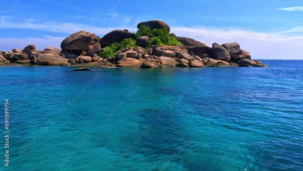 Kho Similan Island Coral reef teaming with reef fish of various colours. the Andaman Sea in Thailand turquoise blue waters white sandy beaches Kho Similan Island Coral reef teaming with reef fish of various colours. the Andaman Sea in Thailand turquoise blue waters white sandy beaches