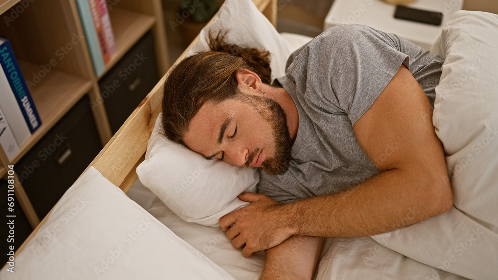 Young hispanic man lying on bed sleeping at bedroom Young hispanic man lying on bed sleeping at bedroom