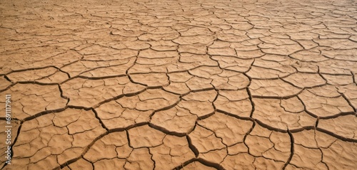  a picture of a desert area that looks like it is cracked and has no grass growing on top of it.