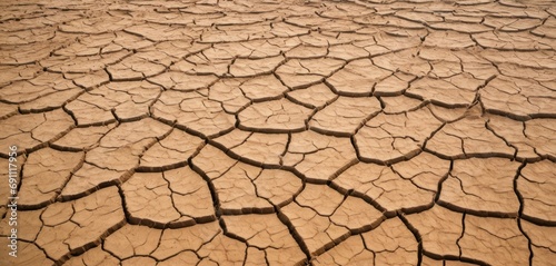  a picture of a cracked earth surface with cracks and cracks in the middle of the ground and dirt on top of it.