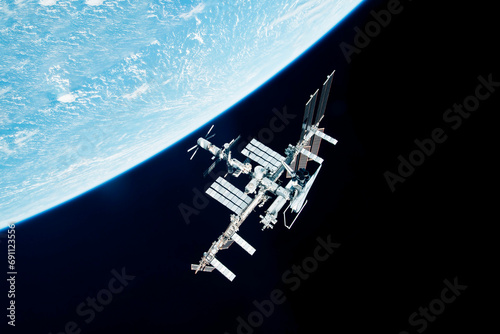 Fototapeta Naklejka Na Ścianę i Meble -  ISS above the surface of planet earth. Elements of this image furnished by NASA