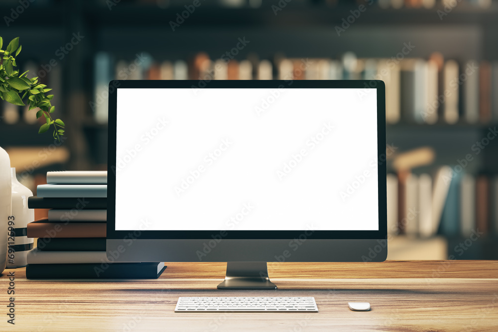 Sleek monitor on desk with books in soft lit library, modern digital workspace. 3D Rendering Sleek monitor on desk with books in soft lit library, modern digital workspace. 3D Rendering
