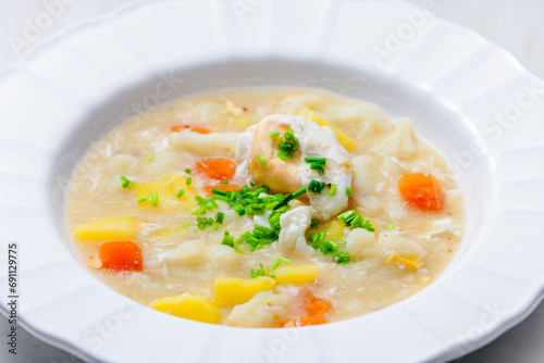 cauliflower soup with carrot, potatoes and poache egg