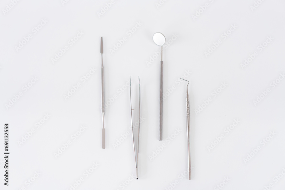 Medical instruments with mirror. Dentist tools on white isolated background. Medical instruments with mirror. Dentist tools on white isolated background.