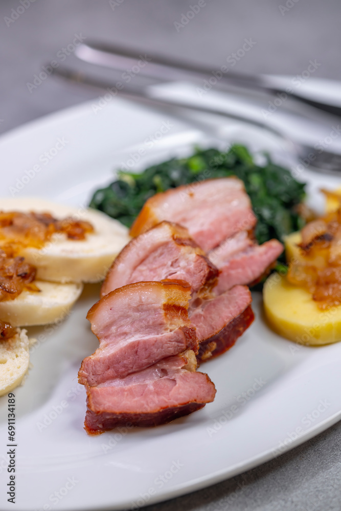 smoked flank with potato and bread dumplings and spinach