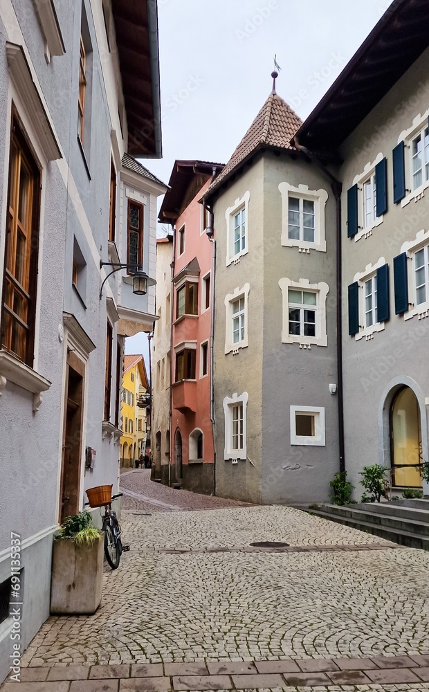 Fototapeta premium Picturesque view of an old street in the historic town of Klausen (Italian: Chiusa) in South Tyrol in northern Italy