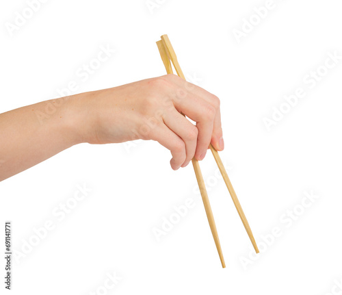 Hand holding wooden chopsticks, Chinese food sticks isolated on white background png photo