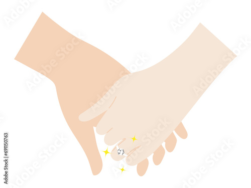 手を握る女性の薬指に輝くエンゲージリング