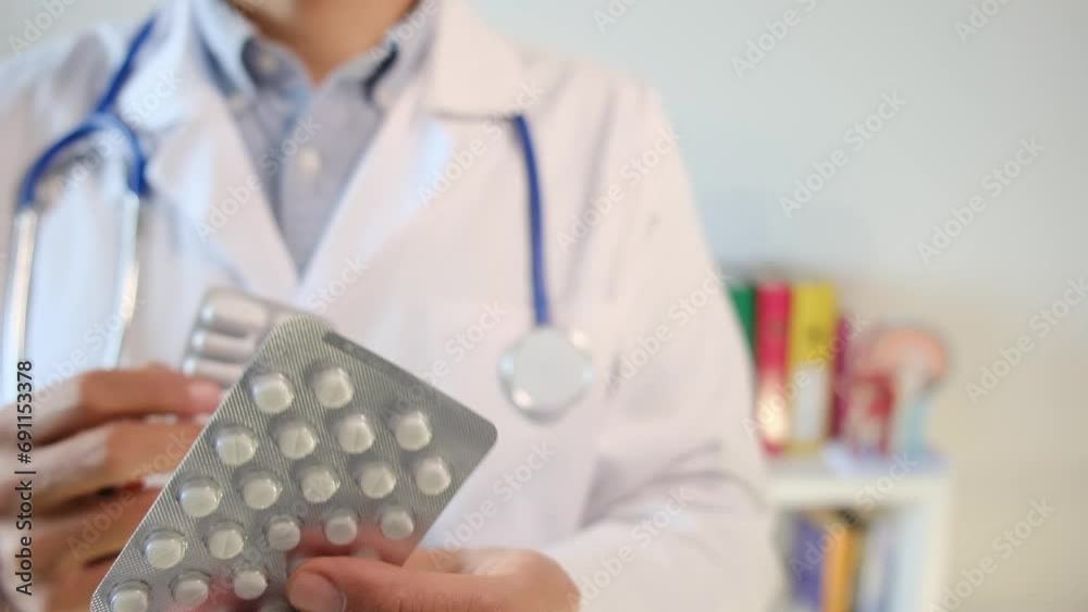 Experience the intricate world of healthcare , featuring a doctor with pills and blister packs. The selective focus invites viewers to contemplate the complex themes of medic. Experience the intricate world of healthcare , featuring a doctor with pills and blister packs. The selective focus invites viewers to contemplate the complex themes of medic.