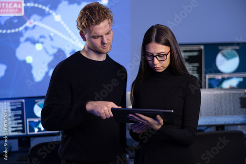 Focused professional cyber security team working to prevent security threats, find vulnerability and solve incidents