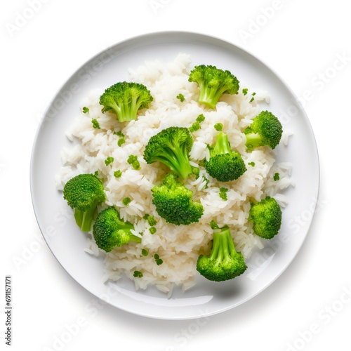 Plate of rice with broccoli on white background, top view.