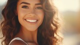 A beautiful woman with a radiant smile and long brown hair. Perfect for portraying happiness and positivity. Ideal for use in advertisements, websites, and social media content