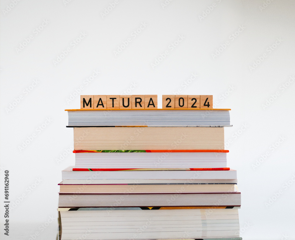 Matura 2024 - napis z drewnianych kostek, ułożony na książkach, maj, egzamin maturalny - obrazy, fototapety, plakaty 
