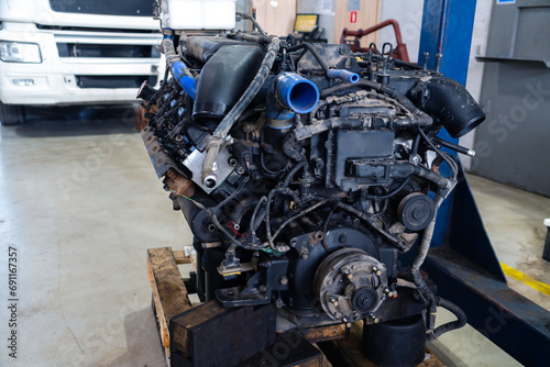 Disassembled engine at a truck repair service