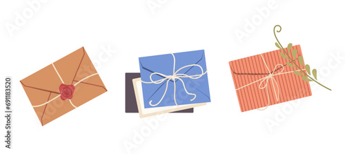 Closed craft paper letter envelop wrapped with decorative rope, string, wax seal and herbs decor