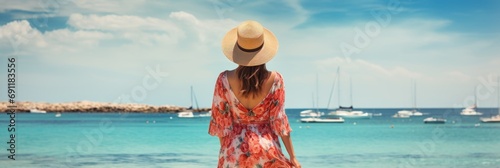 Idyllic summer beach vacation unrecognizable woman blissfully enjoying a sun kissed holiday © Ilja