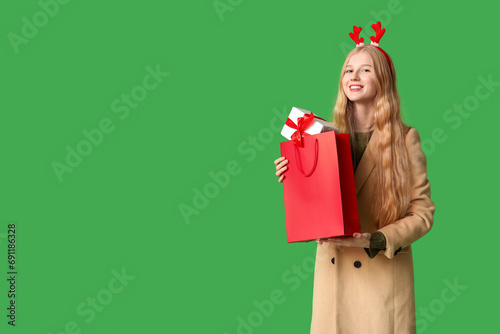 Young happy woman in warm w...